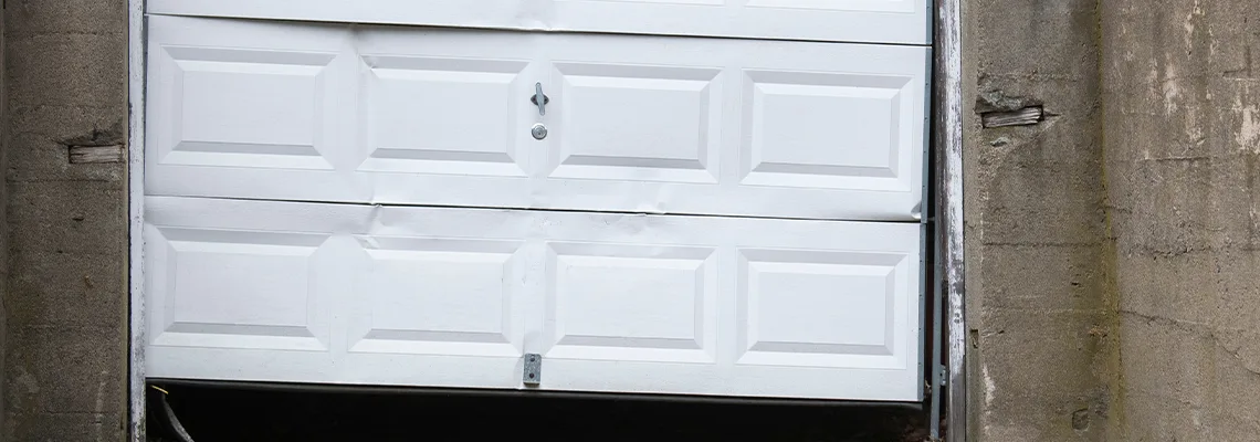 Garage Door Got Hit By A Car Dent Removal in Boca Raton